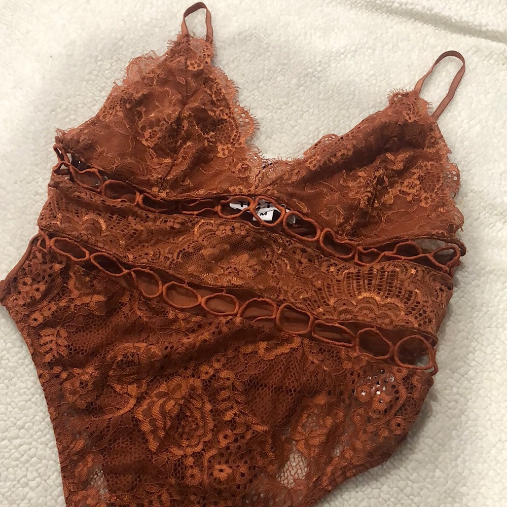 Laura’s boutique rust bodysuit